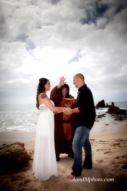 A Jedi-robed officiant marries a couple on the beach