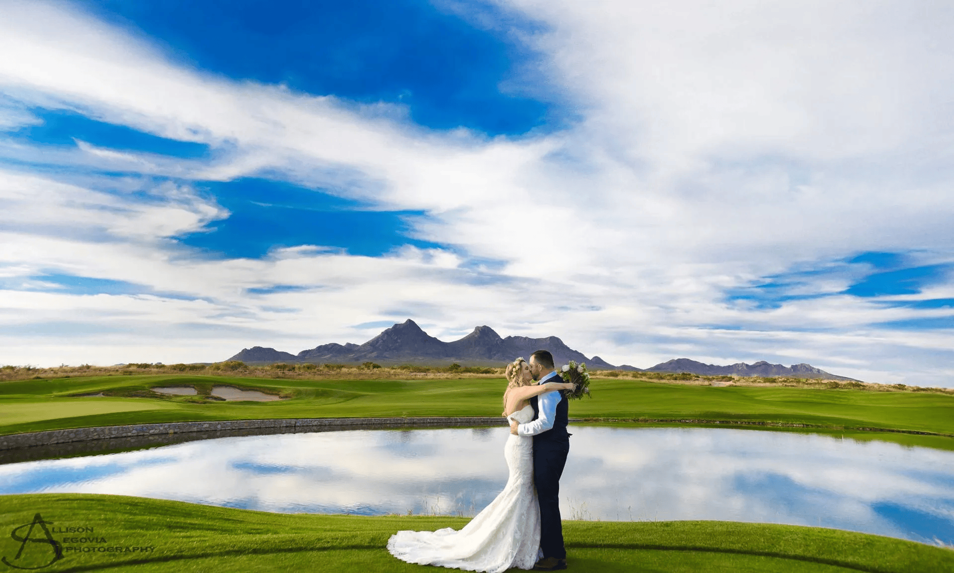 Wedding couple at Red Hawk Golf Club with desert mountains behind